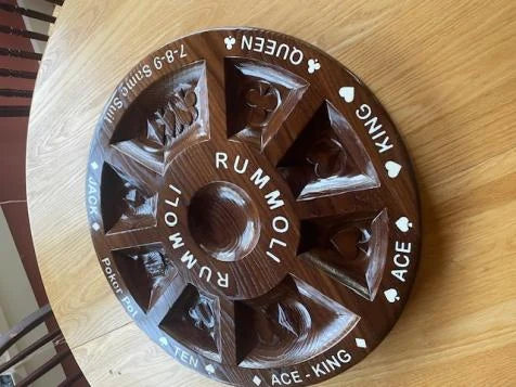 Finished dark wooden Rummoli board with nine card pockets and white inlaid lettering